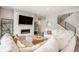 Stylish living room featuring a fireplace, modern decor, and a comfortable sectional sofa for relaxation at 3091 Keepsake Way, Castle Rock, CO 80109