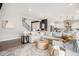 Open-concept living space with a large sectional sofa, modern decor, and seamless flow to the kitchen at 3091 Keepsake Way, Castle Rock, CO 80109