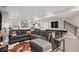 Comfortable seating area in the living room with a large sectional sofa at 3091 Keepsake Way, Castle Rock, CO 80109