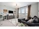 Upstairs loft with multiple windows, decorative rug, and contemporary decor for a cozy gathering space at 3091 Keepsake Way, Castle Rock, CO 80109