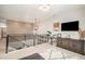 Open loft area with metal stair railing, built in shelves and cabinets, and overhead lighting at 3091 Keepsake Way, Castle Rock, CO 80109