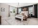 Tranquil main bedroom with large windows, a stylish accent wall, and elegant furnishings for relaxation at 3091 Keepsake Way, Castle Rock, CO 80109
