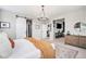 Serene main bedroom features a barn door, soft lighting, and modern decor for a restful retreat at 3091 Keepsake Way, Castle Rock, CO 80109