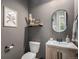 Chic powder room with modern fixtures, stylish decor, and space-saving design for convenience at 3091 Keepsake Way, Castle Rock, CO 80109