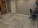 Bright finished basement area with a modern desk, neutral walls, and new paint, ideal for a comfortable workspace at 2700 S High St, Denver, CO 80210