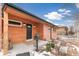 Attractive front exterior featuring a charming brick house, manicured landscaping, and a welcoming front porch at 2700 S High St, Denver, CO 80210