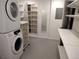 Spacious laundry room with washer/dryer, lots of storage shelving, and bonus storage space at 2700 S High St, Denver, CO 80210