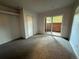 Cozy bedroom with a sliding glass door leading to a private outdoor space and a closet for storage at 2261 S Buckley Rd # 102, Aurora, CO 80013