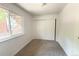 Bright bedroom with carpet flooring, a window view, and a closet at 2261 S Buckley Rd # 102, Aurora, CO 80013