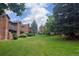 View of the building complex, showing well-maintained grounds and mature trees, enhancing curb appeal at 2261 S Buckley Rd # 102, Aurora, CO 80013