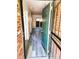 A look inside the front door shows a hallway with nice hard surface floors and access to other rooms at 2261 S Buckley Rd # 102, Aurora, CO 80013