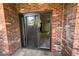 Outdoor patio area with brick and a glass sliding door providing access to the interior space at 2261 S Buckley Rd # 102, Aurora, CO 80013