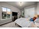 Bedroom with natural light features a large window, closet, and neutral decor at 10783 Backcountry Dr, Highlands Ranch, CO 80126