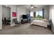 Bedroom featuring a large window, a TV sitting atop dresser, a ceiling fan, and a chair in the corner at 10783 Backcountry Dr, Highlands Ranch, CO 80126