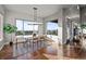 Bright dining area with large windows offering scenic views and modern light fixture at 10783 Backcountry Dr, Highlands Ranch, CO 80126