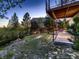 Landscaped backyard with patio and scenic view of the house at 2010 Saddleback Dr, Castle Rock, CO 80104