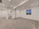 Basement area featuring new carpet, recessed lighting, and a support beam at 2010 Saddleback Dr, Castle Rock, CO 80104