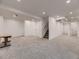 Spacious basement with new carpet, neutral walls, recessed lighting, and ample room for activities at 2010 Saddleback Dr, Castle Rock, CO 80104