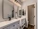 Bathroom with double sinks, modern fixtures, and updated mirrors at 2010 Saddleback Dr, Castle Rock, CO 80104