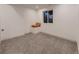 Bright bedroom with carpet, window with outdoor views, and minimalist design with throw pillows at 2010 Saddleback Dr, Castle Rock, CO 80104