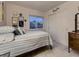 Cozy bedroom featuring a striped bedspread, window with a view, and a double door closet at 2010 Saddleback Dr, Castle Rock, CO 80104