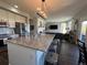 Open-concept kitchen with large island, pendant lighting, and view into the living area at 2010 Saddleback Dr, Castle Rock, CO 80104