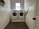 Laundry room featuring a washer, dryer, and beadboard paneling at 2010 Saddleback Dr, Castle Rock, CO 80104