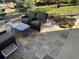 Backyard patio area with comfortable seating and decorative pavers at 2010 Saddleback Dr, Castle Rock, CO 80104