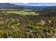 Stunning mountain home nestled within a lush forest setting offering privacy and scenic views at 6803 Snowshoe Trl, Evergreen, CO 80439