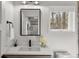 Bathroom featuring a modern vanity with a sleek sink and black faucet, and a window that offers a beautiful view of the outdoors at 6803 Snowshoe Trl, Evergreen, CO 80439