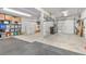 Spacious garage features ample storage, dual overhead doors, and an organized layout at 6803 Snowshoe Trl, Evergreen, CO 80439