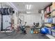 Home gym with weightlifting bench, cardio equipment, and plenty of storage at 6803 Snowshoe Trl, Evergreen, CO 80439