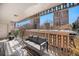 Spacious balcony with city views furnished with a comfortable sofa, perfect for outdoor relaxation at 1223 Race St # 402, Denver, CO 80206