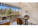Relaxing balcony with city views featuring a bistro table and chairs, ideal for outdoor dining at 1223 Race St # 402, Denver, CO 80206