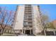 Exterior shot of the building showcasing the facade, multiple balconies, and front entrance at 1223 Race St # 402, Denver, CO 80206