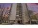 Elegant condo building featuring private balconies and an inviting entrance under a dramatic twilight sky at 1223 Race St # 402, Denver, CO 80206
