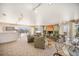 Large living room with fireplace, multiple seating areas, and sliding glass doors to a terrace at 1223 Race St # 402, Denver, CO 80206