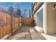 Fenced backyard area with concrete and stone patio for outdoor entertaining and privacy at 4694 S Fraser Ct # A, Aurora, CO 80015