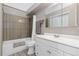Bathroom featuring a shower over bath and vanity, creating a serene and spacious atmosphere at 4694 S Fraser Ct # A, Aurora, CO 80015