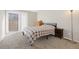Bedroom featuring a sliding glass door and neutral walls, creating a serene and spacious atmosphere at 4694 S Fraser Ct # A, Aurora, CO 80015