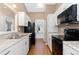 Well-lit kitchen with stainless steel appliances and granite countertops at 4694 S Fraser Ct # A, Aurora, CO 80015