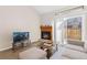 Inviting living room featuring a fireplace and sliding glass door at 4694 S Fraser Ct # A, Aurora, CO 80015