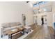 Open living area with vaulted ceilings and hardwood floors at 4694 S Fraser Ct # A, Aurora, CO 80015
