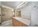 Cozy bathroom featuring a tile shower and coordinating sink with ample counter space at 5191 S Hannibal Way, Centennial, CO 80015