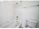 Clean bathroom featuring a white tiled bathtub and shower combo at 5191 S Hannibal Way, Centennial, CO 80015