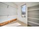 Walk-in closet with built-in shelving and hanging rods, plus a window offering exterior views at 5191 S Hannibal Way, Centennial, CO 80015
