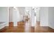 Bright foyer with hardwood floors, white columns, and a staircase leading to the upper level at 5191 S Hannibal Way, Centennial, CO 80015
