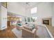 Bright living room with a cozy fireplace and a comfortable seating area with sofas at 5191 S Hannibal Way, Centennial, CO 80015