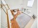 Bright, open-concept living area with hardwood floors, a kitchen, a living room, and multiple windows at 5191 S Hannibal Way, Centennial, CO 80015