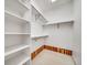 Walk-in closet with built-in shelving and hanging rods offering ample storage space at 5191 S Hannibal Way, Centennial, CO 80015
